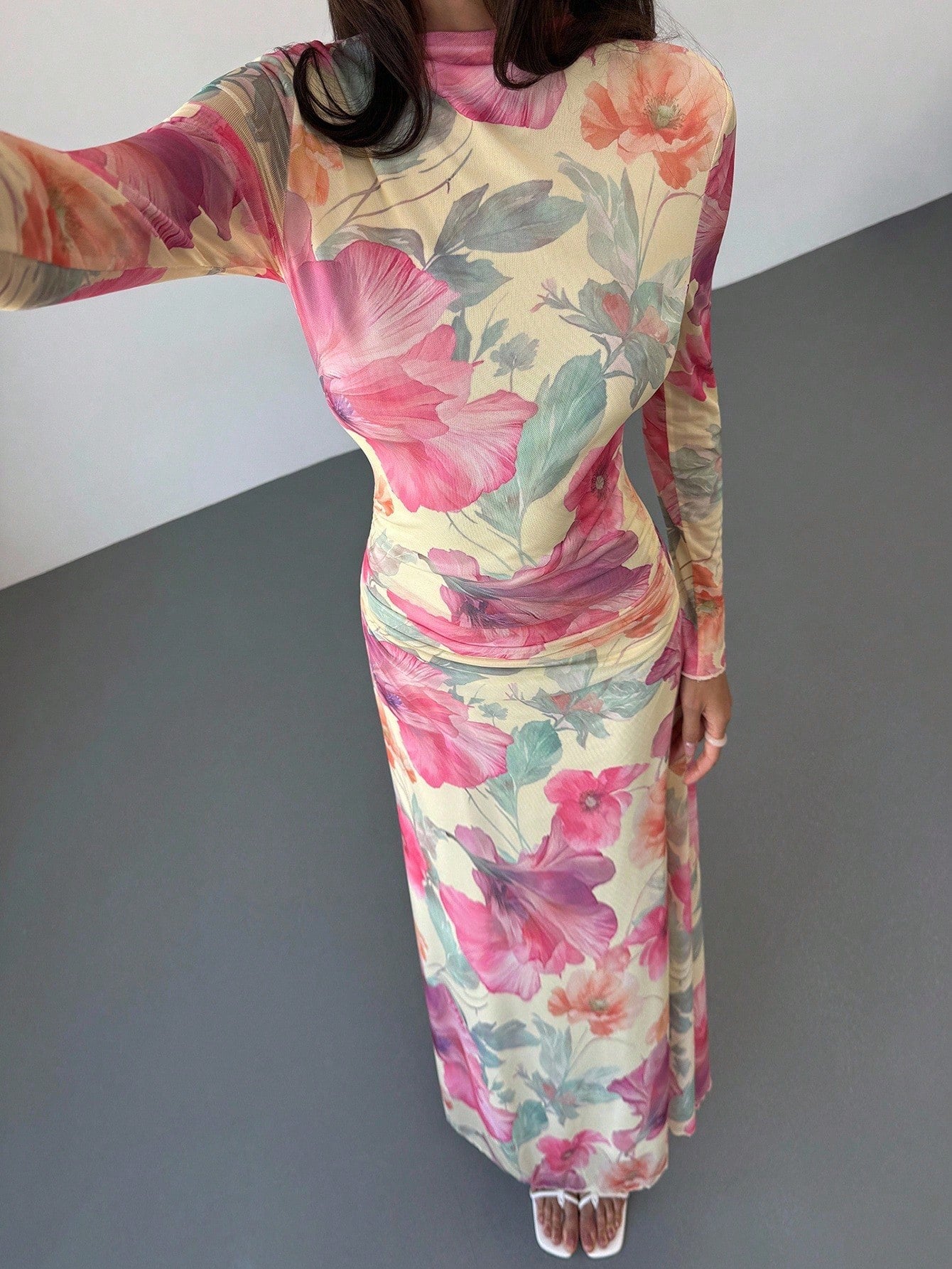 Model wearing the Fashzeo floral mesh long-sleeve maxi dress in apricot multicolor.