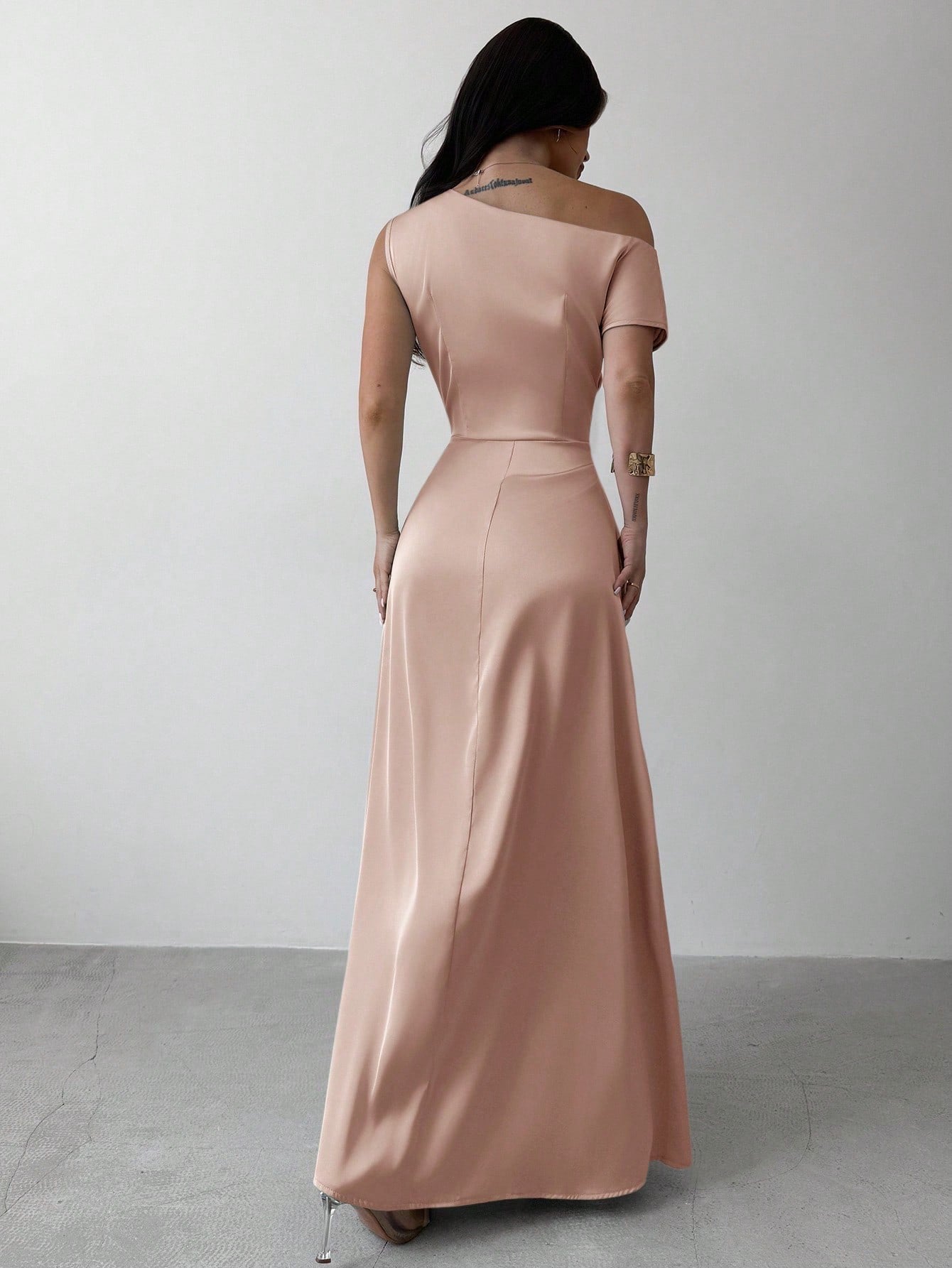 Model wearing the Fashzeo pink satin one-shoulder maxi gown with ruched detailing