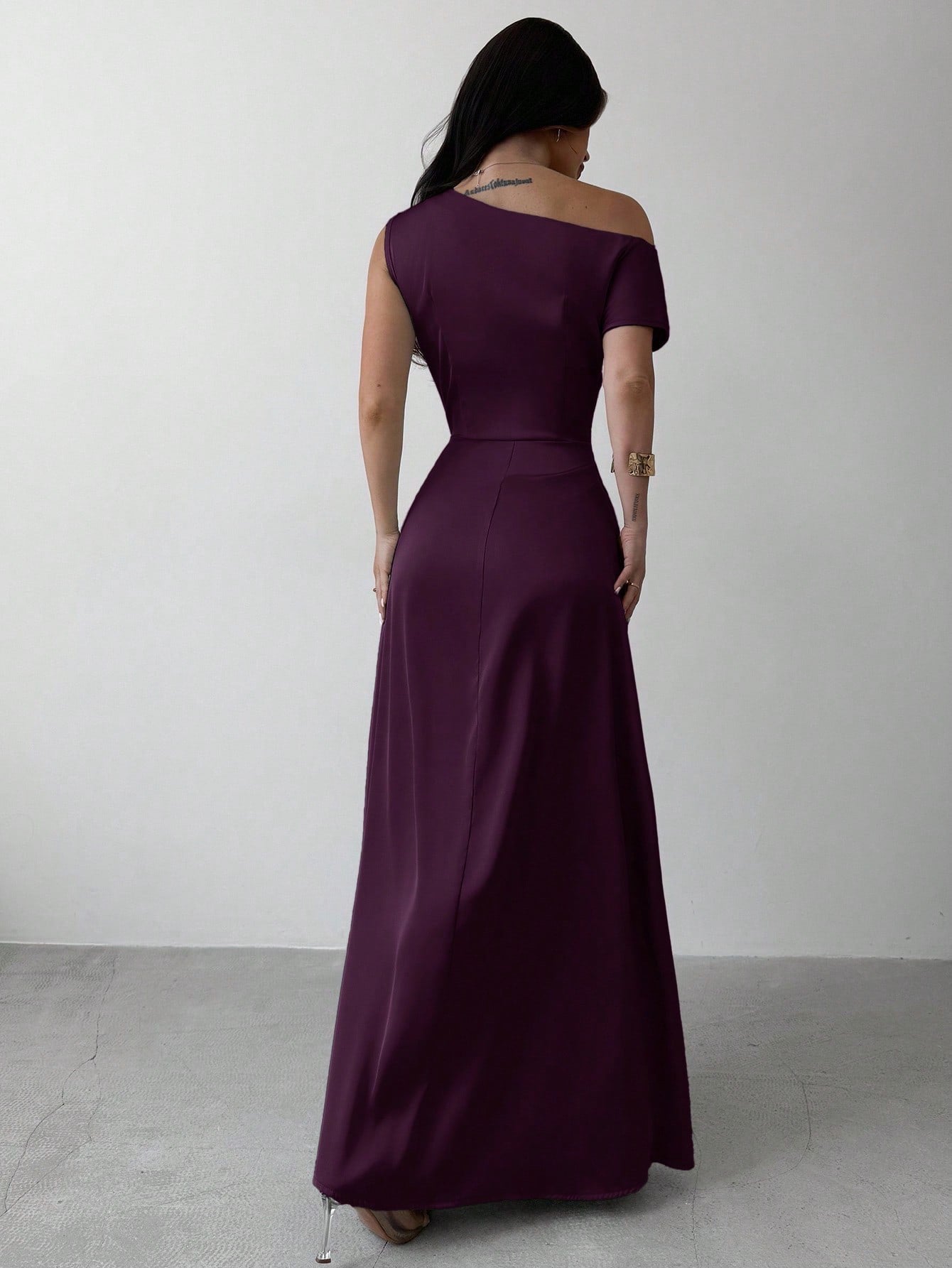 Model wearing the Fashzeo purple satin one-shoulder maxi gown with ruched detailing