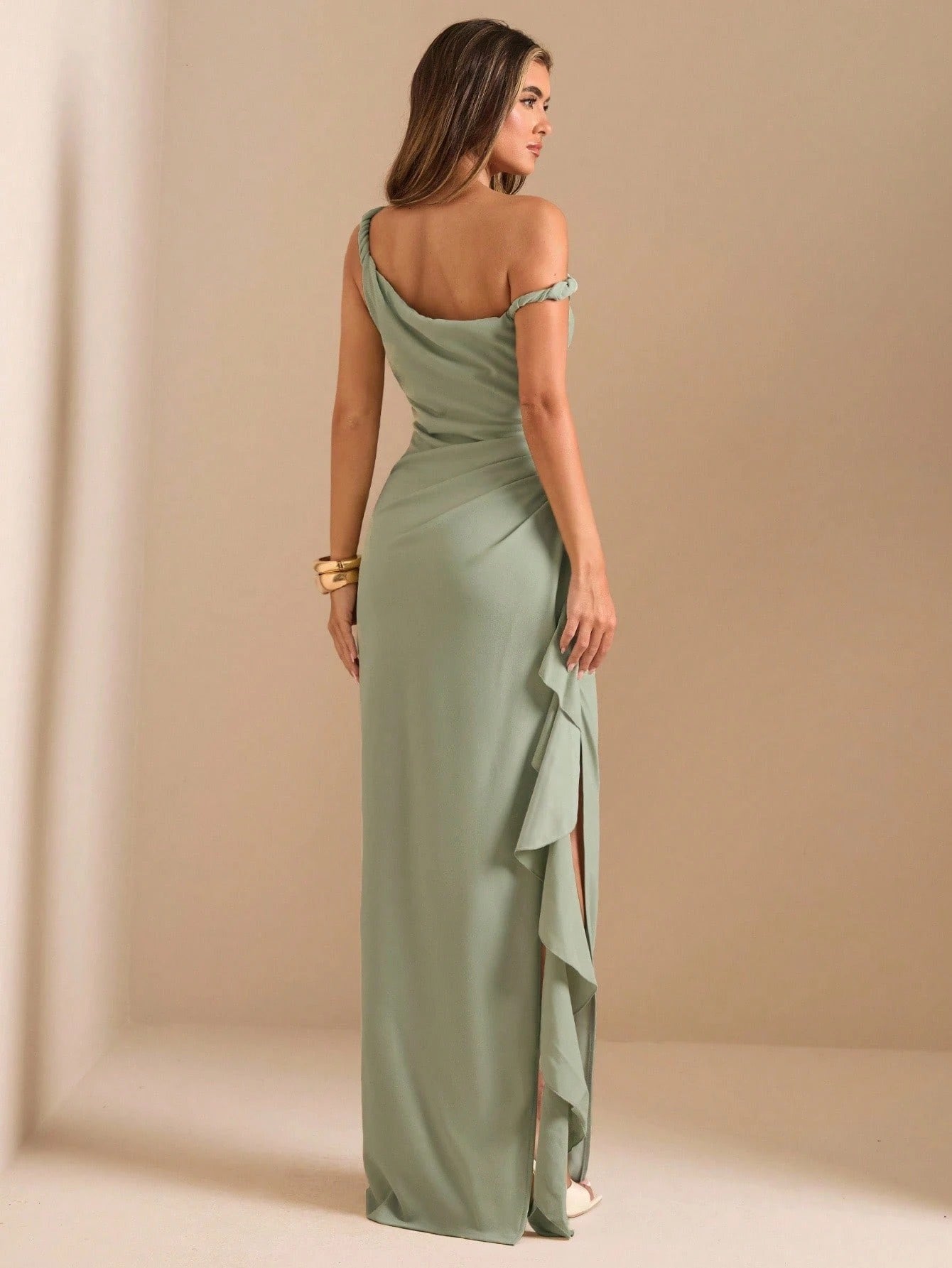 Model wearing the Fashzeo sage green asymmetric one-shoulder maxi gown with high-leg slit
