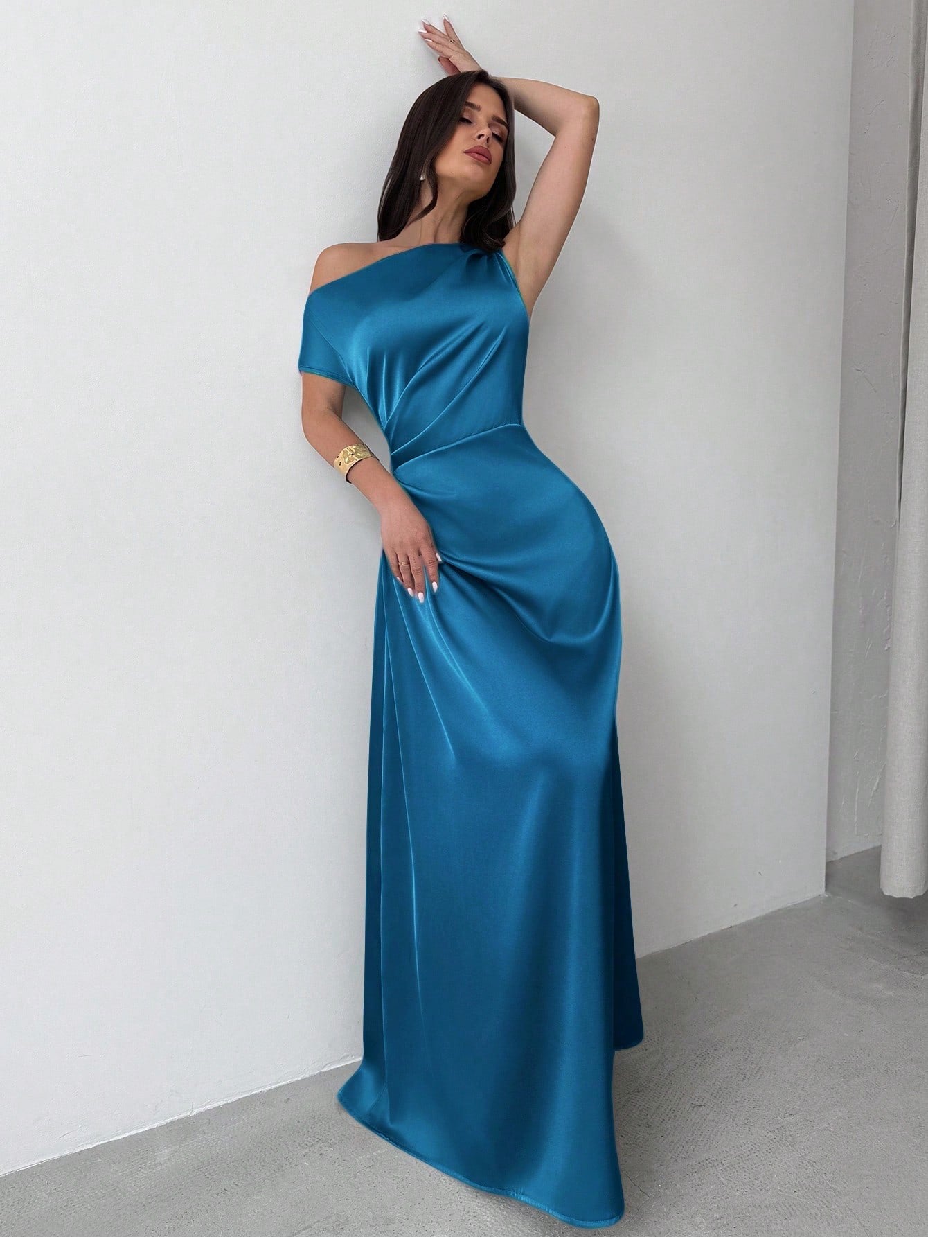Model wearing the Fashzeo teal blue satin one-shoulder maxi gown with ruched detailing