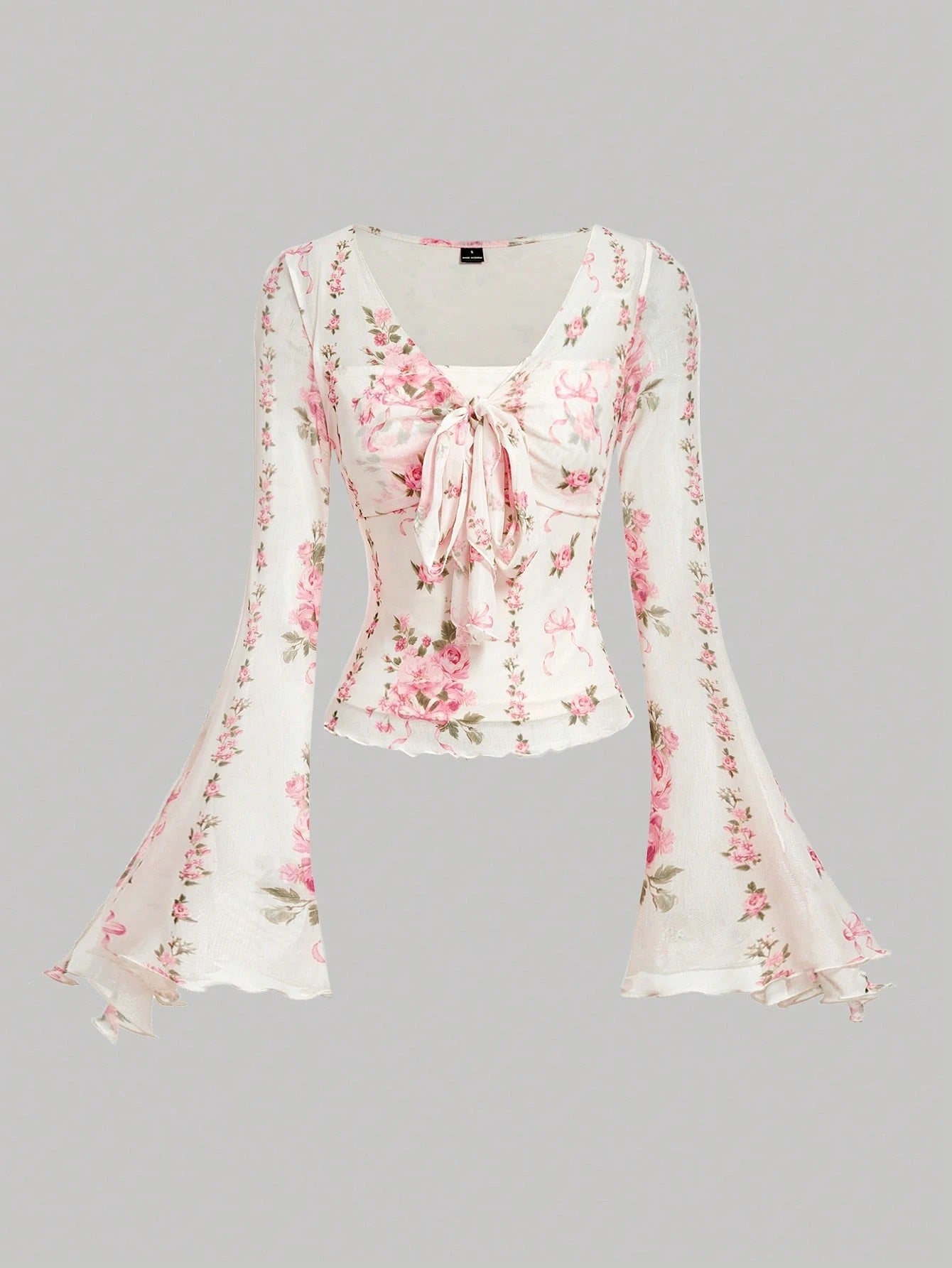 Pink and white floral print tie-front flare sleeve top laid flat against a neutral background