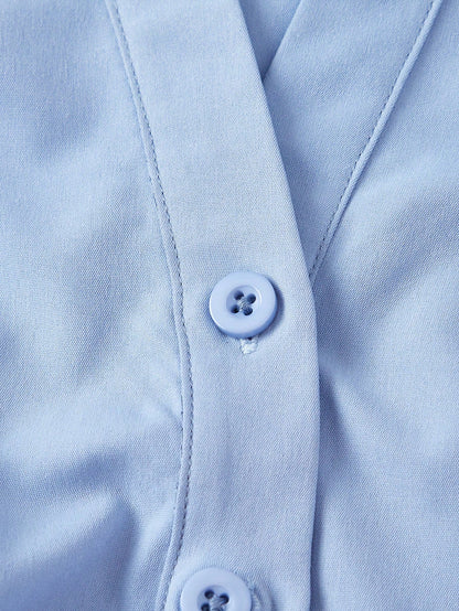 Solid color blue button-down shirt with lapel collar, lantern sleeves, and waist lace-up corset ties laid flat