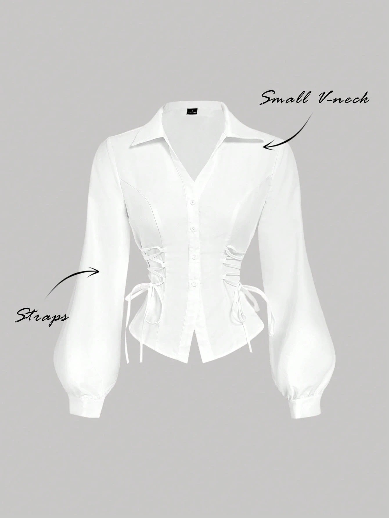Solid color white button-down shirt with lapel collar, lantern sleeves, and waist lace-up corset ties laid flat