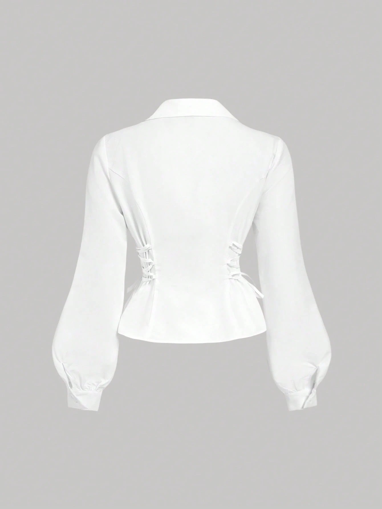Solid color white button-down shirt with lapel collar, lantern sleeves, and waist lace-up corset ties laid flat