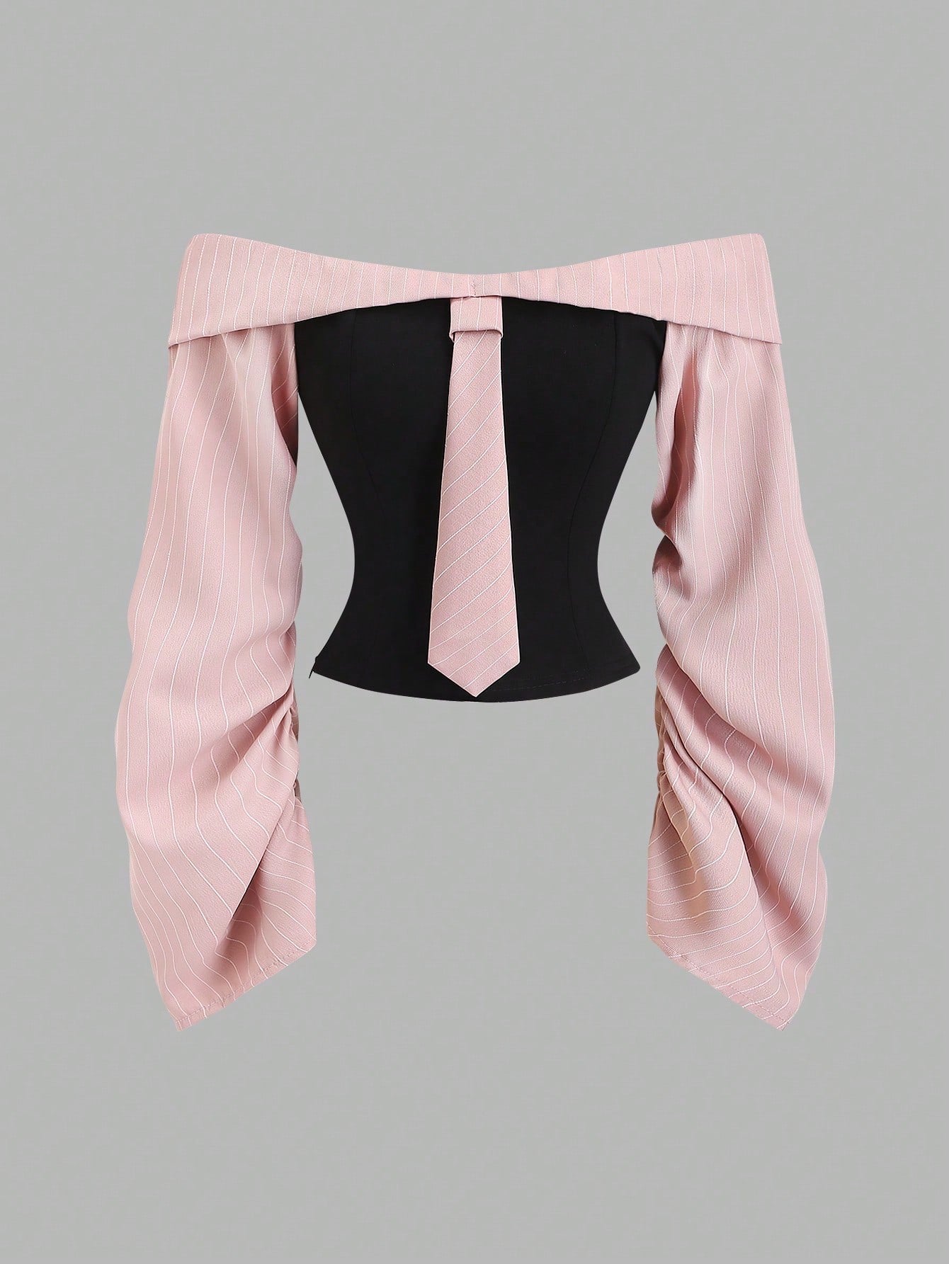 Two-tone off-shoulder black top with striped pink sleeves and an attached necktie detail laid flat against a neutral background