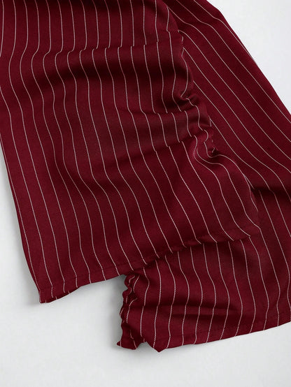 Two-tone off-shoulder black top with striped red sleeves and an attached necktie detail laid flat against a neutral background