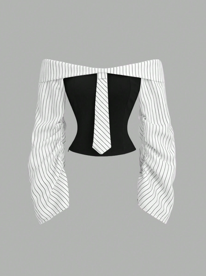 Two-tone off-shoulder black top with striped white sleeves and an attached necktie detail laid flat against a neutral background