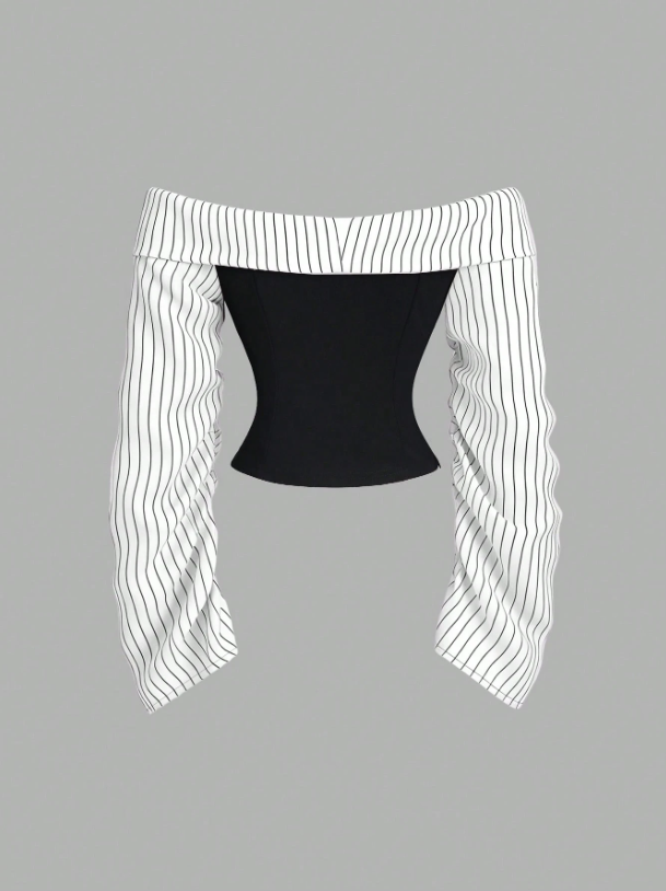 Two-tone off-shoulder black top with striped white sleeves and an attached necktie detail laid flat against a neutral background