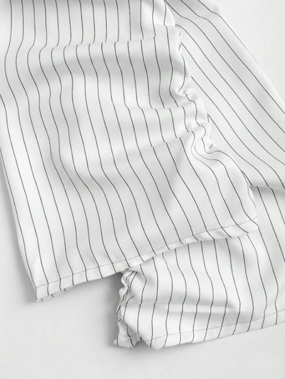 Two-tone off-shoulder black top with striped white sleeves and an attached necktie detail laid flat against a neutral background