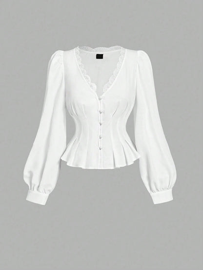 White striped long-sleeve peplum blouse with a lace-trim V-neck, button-front closure, and lantern sleeves against a neutral background.