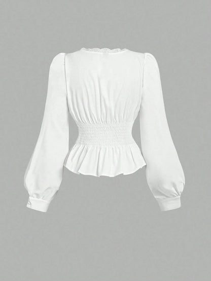 White striped long-sleeve peplum blouse with a lace-trim V-neck, button-front closure, and lantern sleeves against a neutral background.