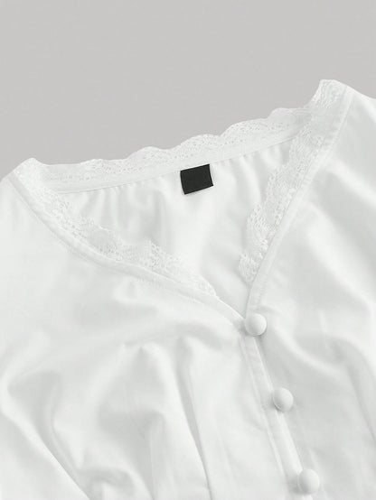White striped long-sleeve peplum blouse with a lace-trim V-neck, button-front closure, and lantern sleeves against a neutral background.