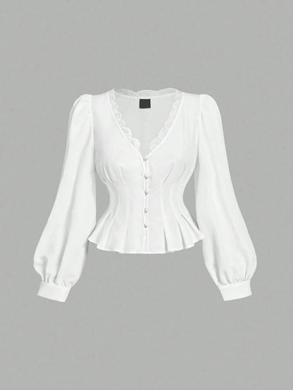 White striped long-sleeve peplum blouse with a lace-trim V-neck, button-front closure, and lantern sleeves against a neutral background.