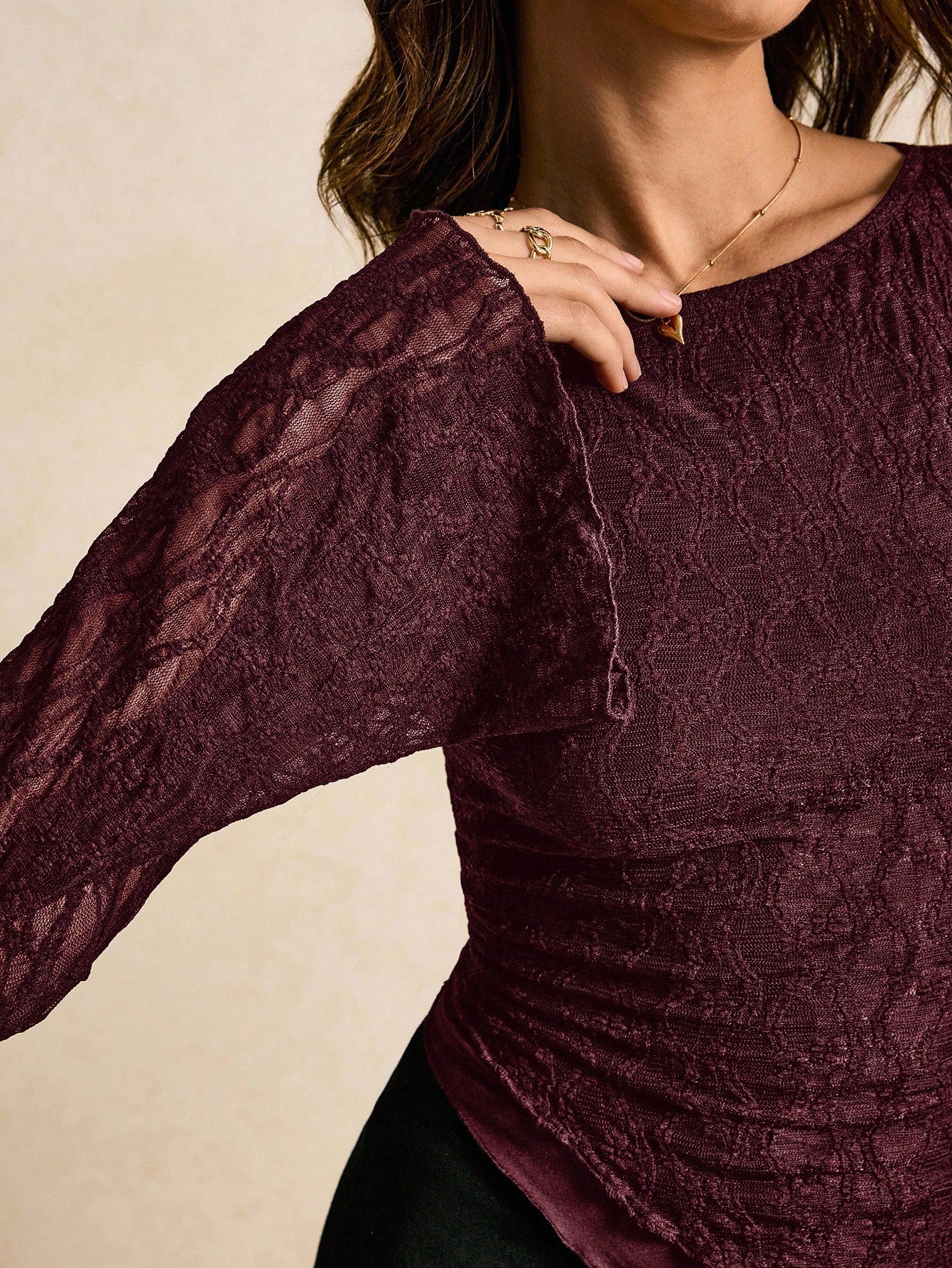Women's elegant lace flare sleeve asymmetric top in white, brown, red violet, and black paired with a black skirt for a trendy Gen Z look.
