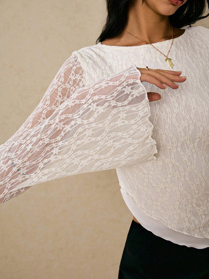 Women's elegant lace flare sleeve asymmetric top in white, brown, red violet, and black paired with a black skirt for a trendy Gen Z look.
