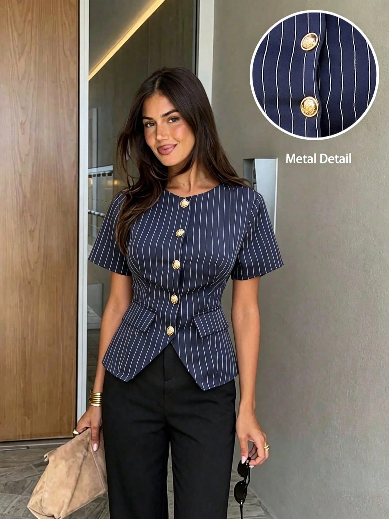 Women's navy blue pinstripe short-sleeve slim-fit peplum top with gold buttons paired with a black skirt for an office chic look.