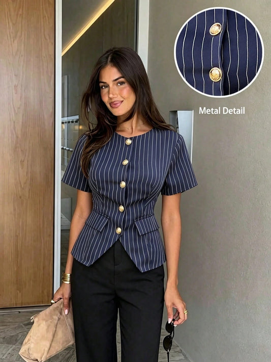 Women's navy blue pinstripe short-sleeve slim-fit peplum top with gold buttons paired with a black skirt for an office chic look.