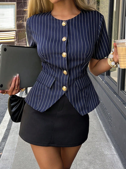Women's navy blue pinstripe short-sleeve slim-fit peplum top with gold buttons paired with a black skirt for an office chic look.