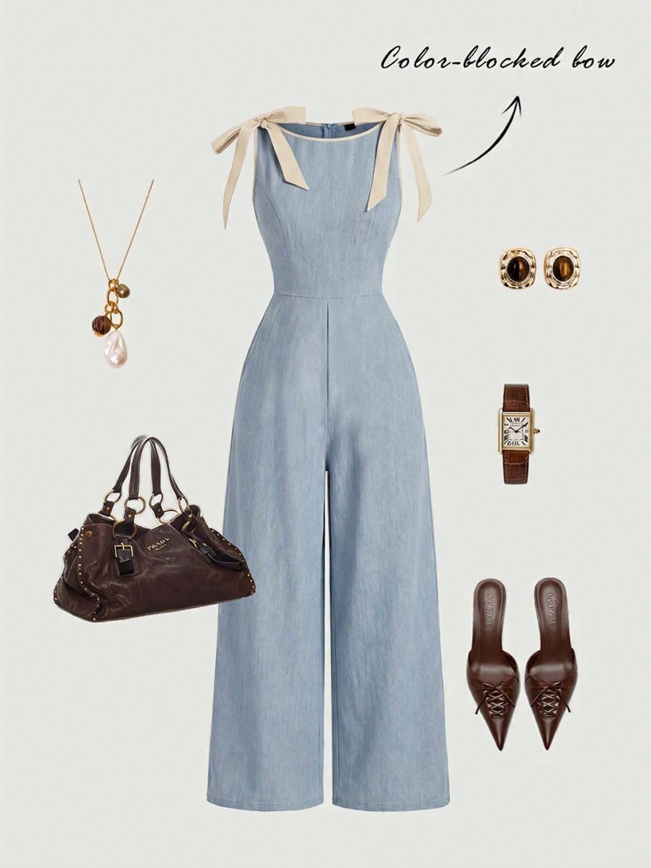 blue wide-leg sleeveless jumpsuit featuring contrast brown shoulder bow ties and trim laid flat against a neutral background