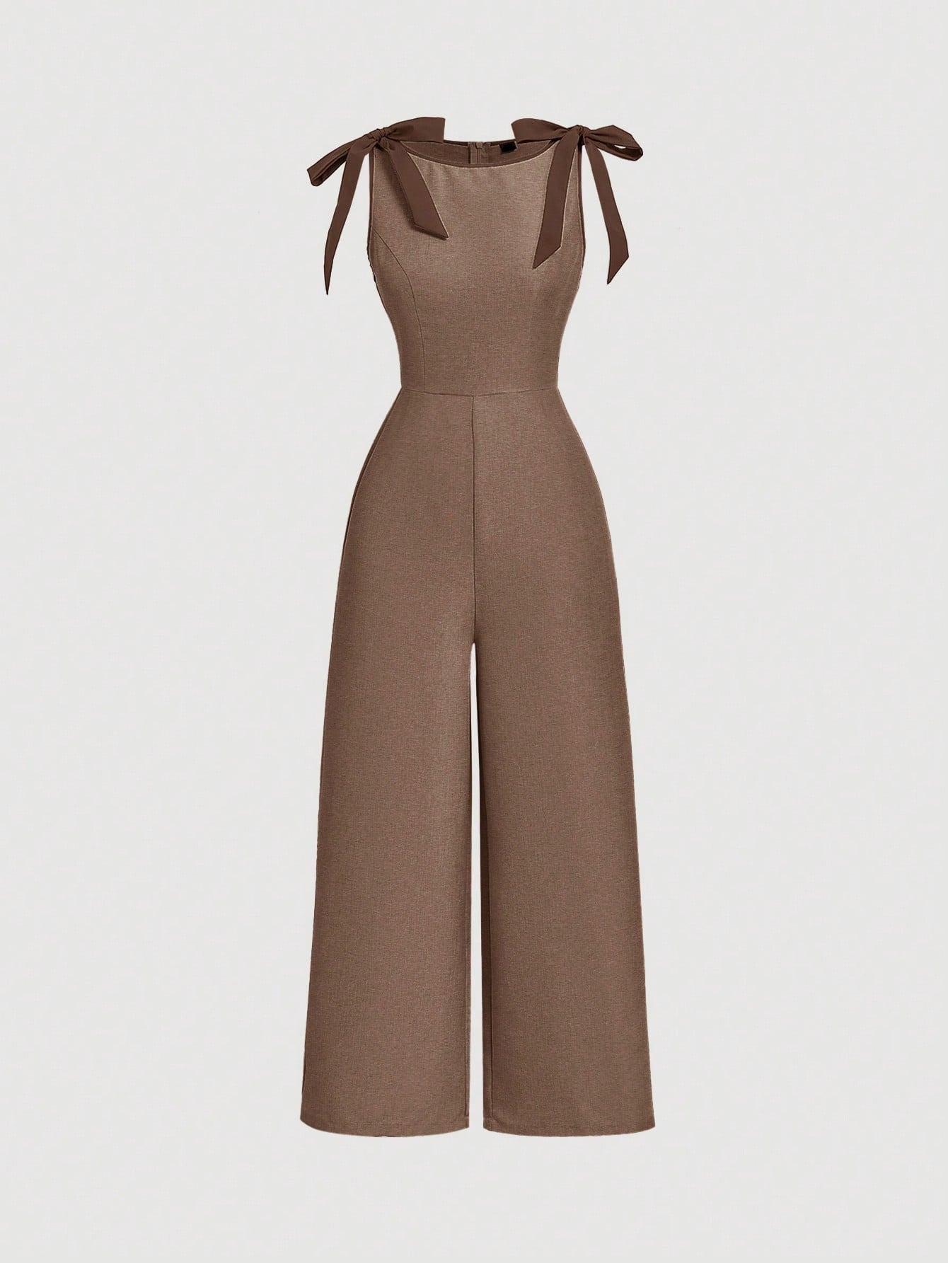 brown wide-leg sleeveless jumpsuit featuring contrast brown shoulder bow ties and trim laid flat against a neutral background