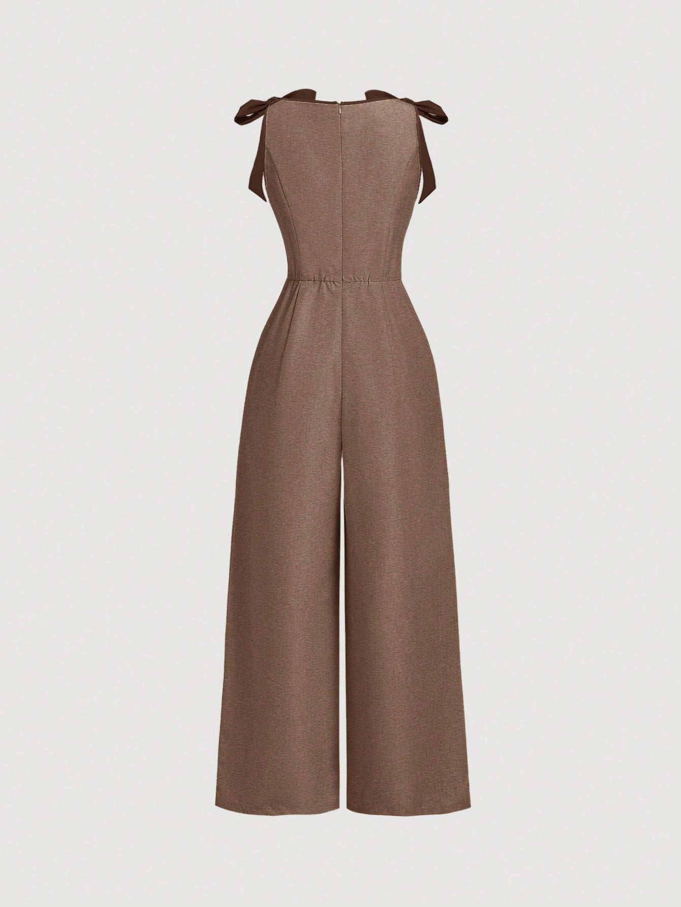 brown wide-leg sleeveless jumpsuit featuring contrast brown shoulder bow ties and trim laid flat against a neutral background